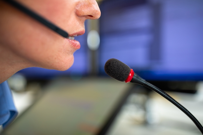 Call center employee communicating over phone