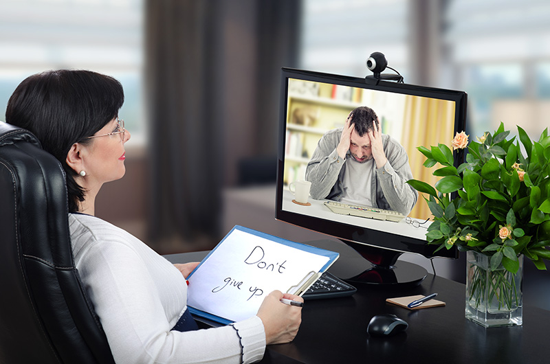 Virtual psychotherapist intends to help to depressed man through telehealth mental health appointment