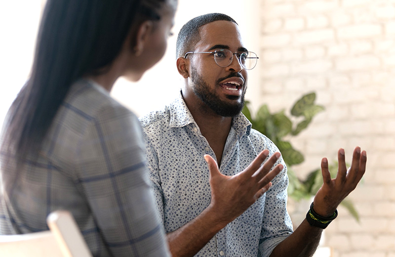 young african american male psychologist meeting patients