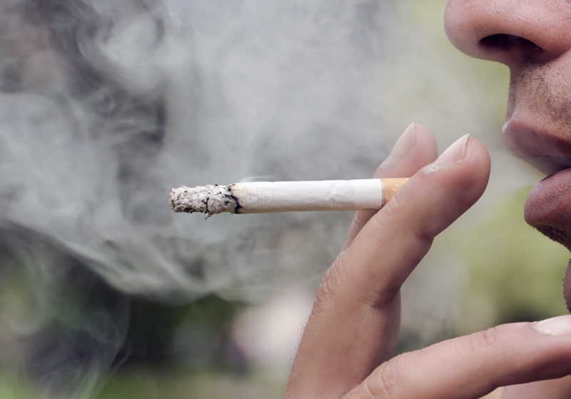 A man smoking a cigarette