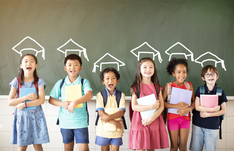 A group of diverse young students standing together in classroom