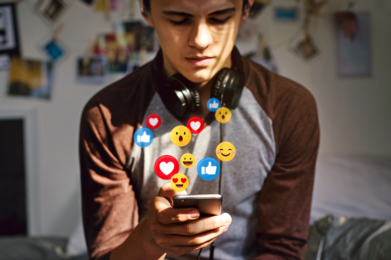 Young man watching a live streaming on his phone