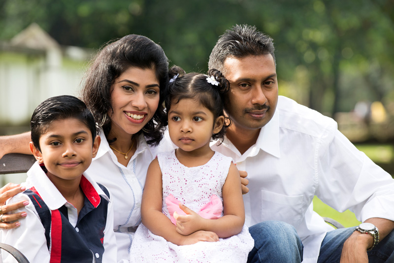 South Asian family sitting outside for mental health