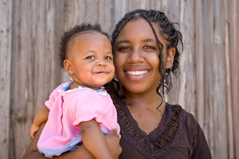 African American teenage mother and her daughter.