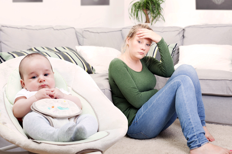 Young new mother suffering from postpartum depression