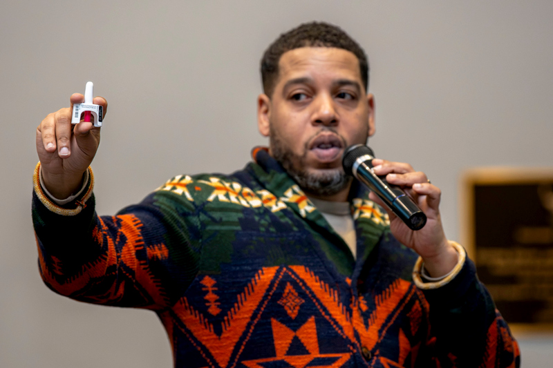 Elan Quashie demonstrates how to safely administer Naloxone at a 2024 training session hosted by NYC Health + Hospitals/Woodhull. Photo credit: NYC Health + Hospitals.