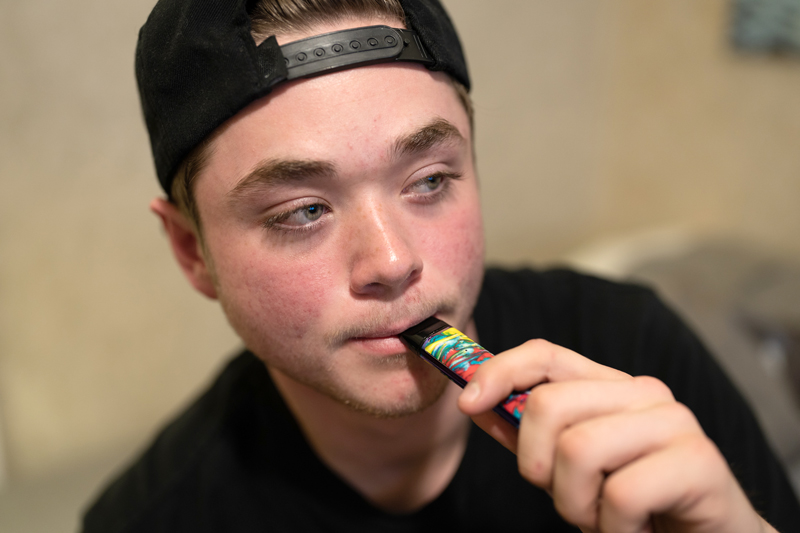 teen is getting ready to vape with THC