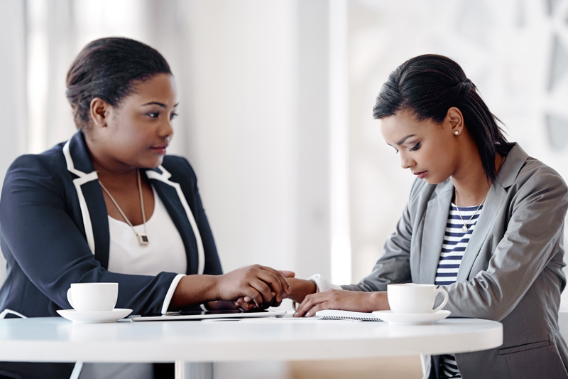 Comfort, women and support with empathy, care and solidarity in office as psychologist for company. Female people, listen and compassion for grief counselling, conversation and mental health at work