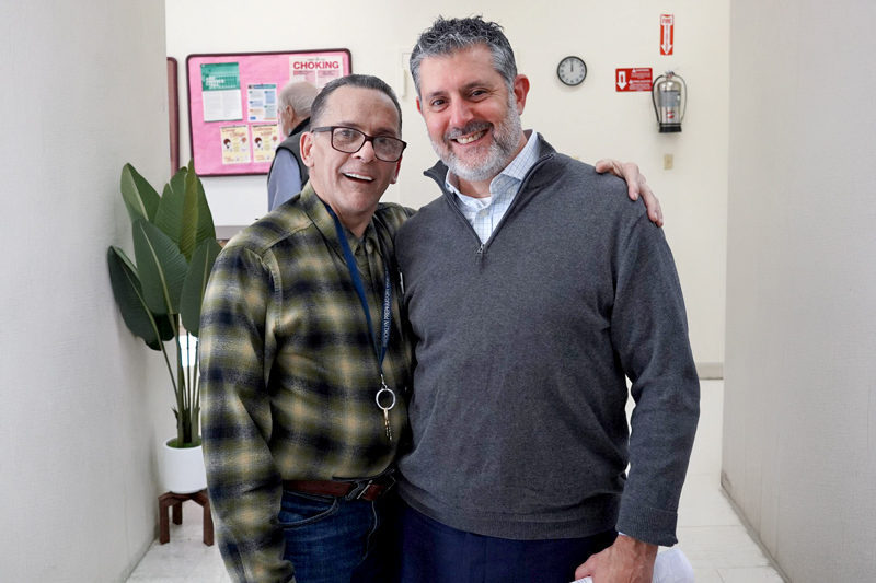 Marc Damsky, MPH, with a client on a visit to SPOP. Photo Credit: Manny Amatrudo