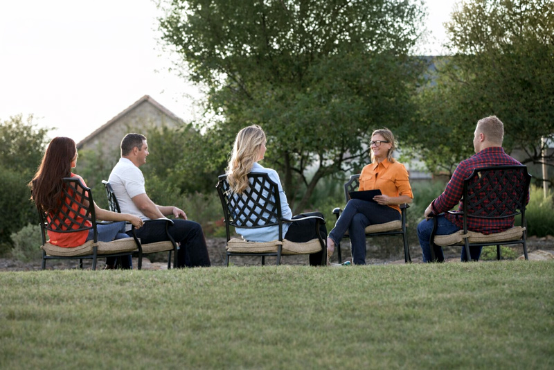 Residents at Enterhealth participate in an outdoor group session focused on peer support and connection.